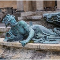 A lion roars at a merman halved..jpg